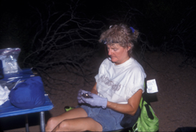 Karen in a chair, holding a bat